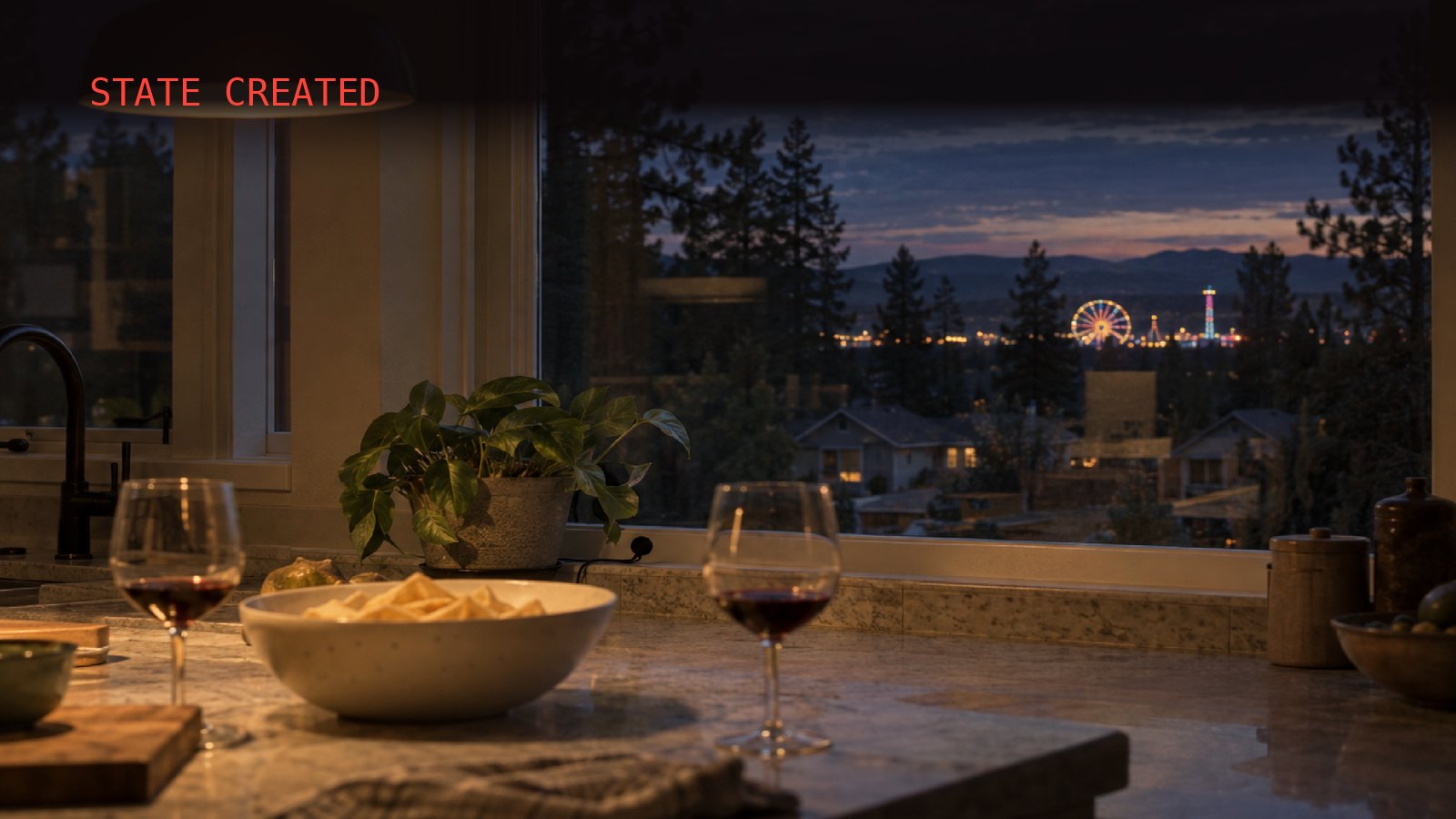 A dim kitchen at dusk: two glasses of red wine and a bowl of chips on the counter under a warm pendant lamp, and through the big window, past dark pines and rooftops, a lit Ferris wheel glows at a carnival on the horizon.